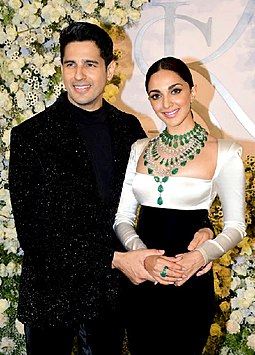 a man and woman posing for a picture Bollywood actress kiara adavani and shidhart malhotra